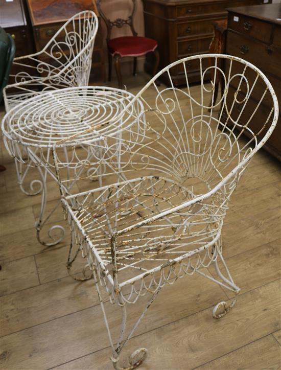 A white painted wrought iron garden table and 2 chairs